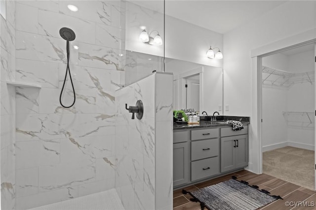 9074 Winter Spring Dr, Mechanicsville, VA 23116 - full bath with double vanity, wood finish floors, a marble finish shower, and a spacious closet