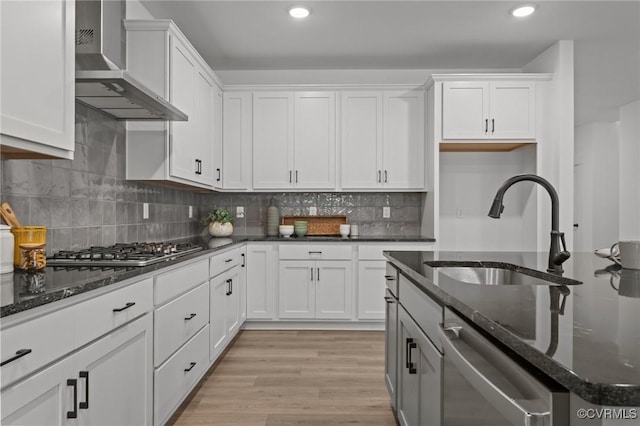 9074 Winter Spring Dr, Mechanicsville, VA 23116 - kitchen with appliances with stainless steel finishes, a sink, wall chimney exhaust hood, white cabinets, and dark stone countertops