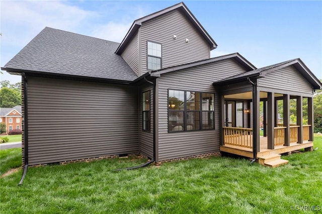 9074 Winter Spring Dr, Mechanicsville, VA 23116 - rear view of house featuring a sunroom, a lawn, and a shingled roof
