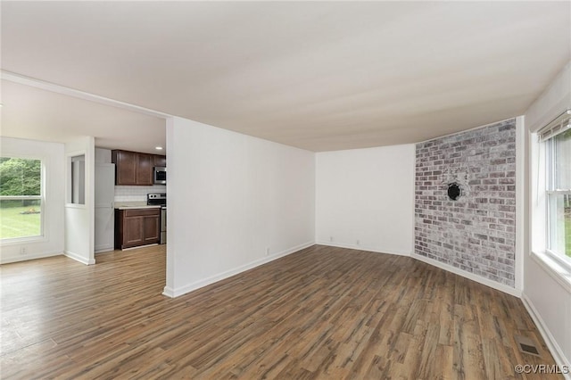 3027 Supply Rd, Port Royal, VA 22436 - unfurnished living room with wood finished floors and baseboards