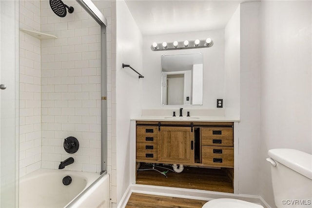 3027 Supply Rd, Port Royal, VA 22436 - bathroom featuring toilet, vanity, bathtub / shower combination, wood finished floors, and baseboards