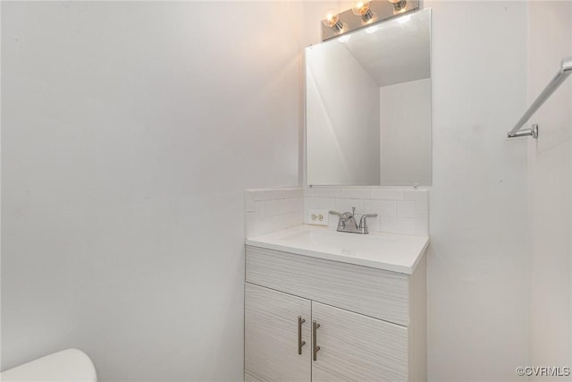 3027 Supply Rd, Port Royal, VA 22436 - half bathroom featuring backsplash, vanity, and toilet