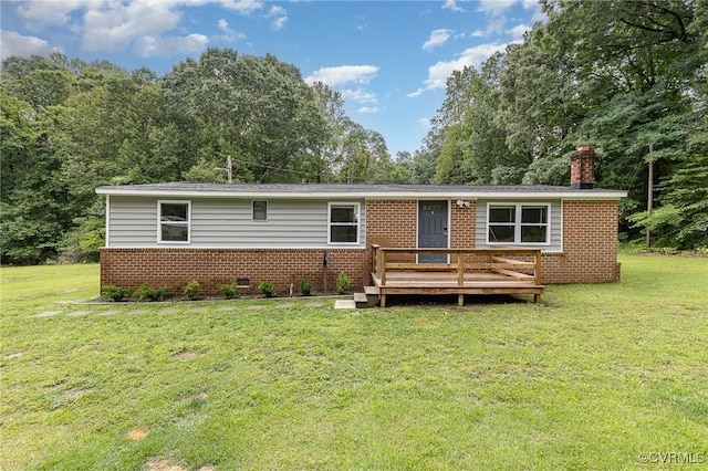 3027 Supply Rd, Port Royal, VA 22436 - view of front of house featuring brick siding, a deck, a front yard, and a chimney