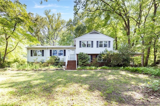 6495 Robin Way, Mechanicsville, VA 23111 - split level home with a front lawn and brick siding