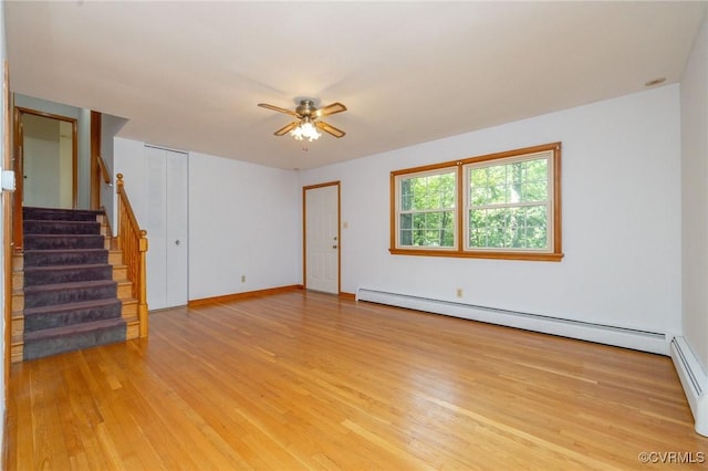 6495 Robin Way, Mechanicsville, VA 23111 - unfurnished room featuring light wood-style floors, a ceiling fan, stairway, a baseboard heating unit, and baseboards