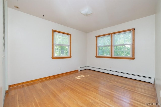 6495 Robin Way, Mechanicsville, VA 23111 - spare room with healthy amount of natural light, wood finished floors, a baseboard radiator, and baseboards