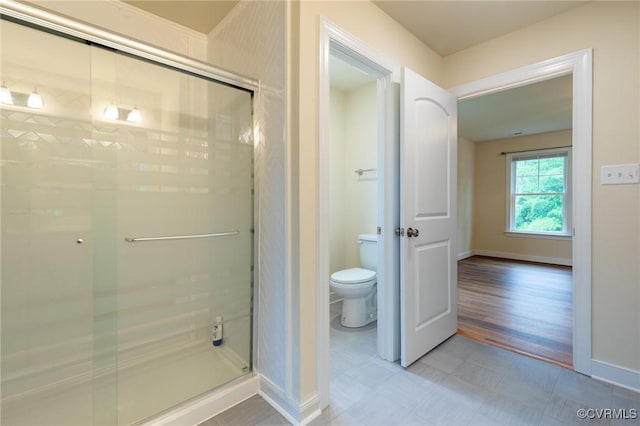 207 Eliza Ln, Aylett, VA 23009 - bathroom with tile patterned floors, a shower stall, toilet, and baseboards