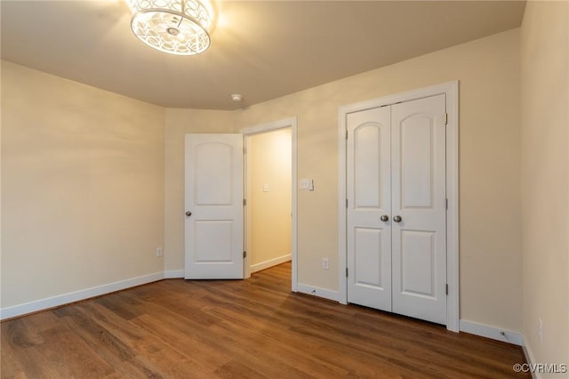 207 Eliza Ln, Aylett, VA 23009 - unfurnished bedroom featuring baseboards, wood finished floors, and a closet