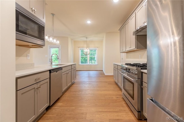 207 Eliza Ln, Aylett, VA 23009 - kitchen featuring appliances with stainless steel finishes, gray cabinets, under cabinet range hood, light wood-style floors, and recessed lighting