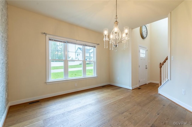 207 Eliza Ln, Aylett, VA 23009 - unfurnished room with a chandelier, wood finished floors, baseboards, and stairs