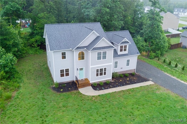 207 Eliza Ln, Aylett, VA 23009 - view of front facade featuring gravel driveway, a front lawn, and a shingled roof