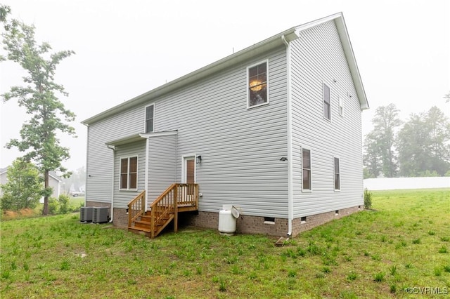207 Eliza Ln, Aylett, VA 23009 - rear view of house featuring crawl space, cooling unit, and a lawn