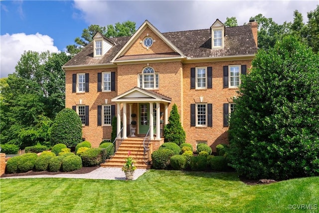 4029 Huntsteed Way, Henrico, VA 23233 - colonial inspired home featuring a chimney, a front lawn, and brick siding