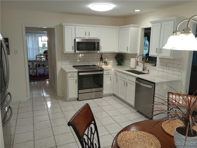 1412 Pritchard Ter, Chesterfield, VA 23235 - kitchen featuring stainless steel appliances, a sink, light countertops, tasteful backsplash, and recessed lighting