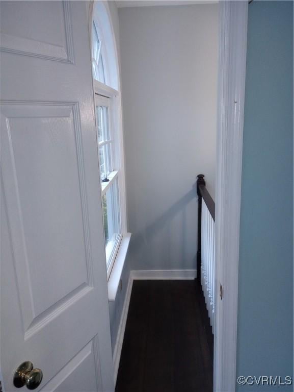 1412 Pritchard Ter, Chesterfield, VA 23235 - corridor with healthy amount of natural light, an upstairs landing, dark wood finished floors, and baseboards