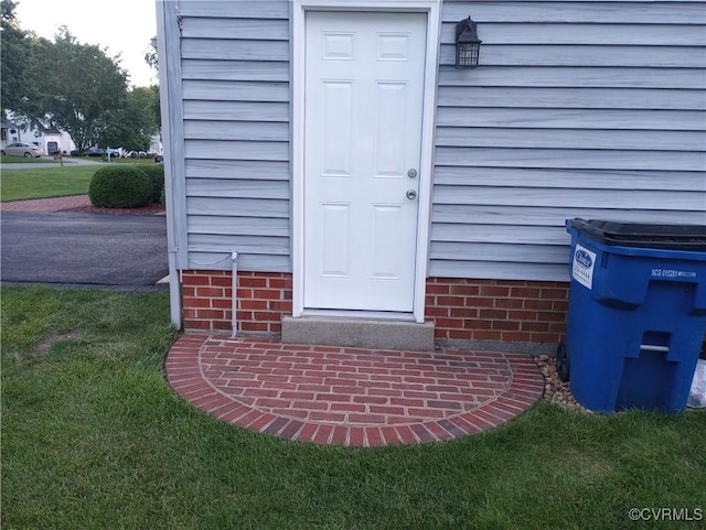 1412 Pritchard Ter, Chesterfield, VA 23235 - view of exterior entry with a yard
