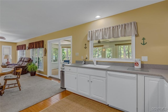 431 Ships Row, Montross, VA 22520 - kitchen featuring white dishwasher, white cabinets, light wood finished floors, recessed lighting, and open floor plan