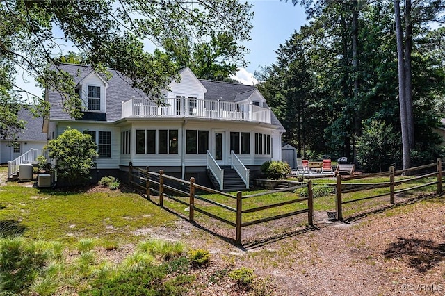 431 Ships Row, Montross, VA 22520 - rear view of property featuring a balcony, a shed, a sunroom, and roof with shingles