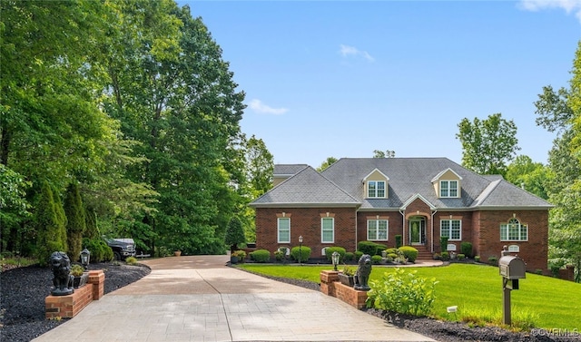 2220 French Hill Ter, Powhatan, VA 23139 - view of front facade featuring brick siding, a front lawn, and driveway