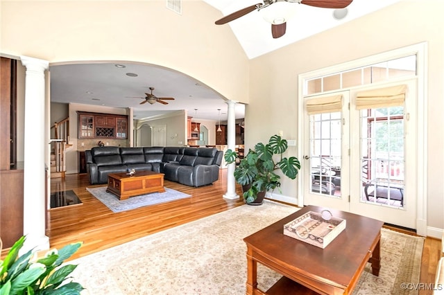 2220 French Hill Ter, Powhatan, VA 23139 - living room with decorative columns, ceiling fan, wood finished floors, arched walkways, and vaulted ceiling