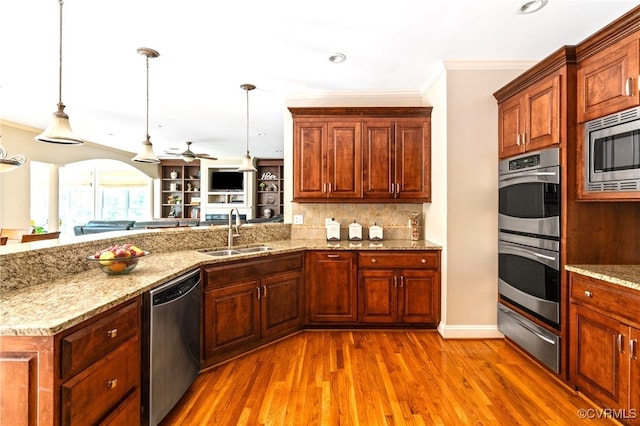 2220 French Hill Ter, Powhatan, VA 23139 - kitchen with appliances with stainless steel finishes, a sink, a warming drawer, crown molding, and a ceiling fan