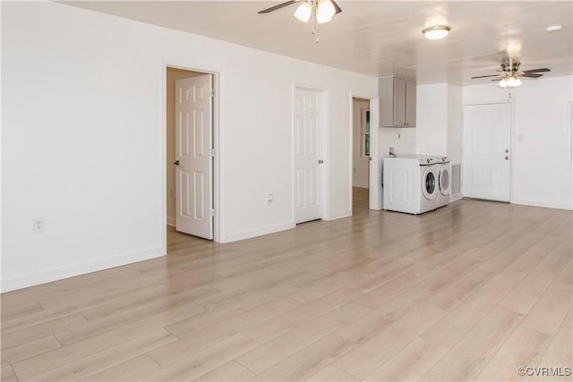 321 Porterville St, Petersburg, VA 23803 - unfurnished living room featuring separate washer and dryer, a ceiling fan, light wood finished floors, and baseboards