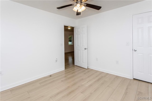 321 Porterville St, Petersburg, VA 23803 - unfurnished bedroom with light wood-style flooring, baseboards, and a ceiling fan