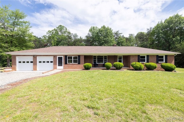 215 Glen Rd, Dillwyn, VA 23936 - single story home featuring a garage, gravel driveway, brick siding, and a front yard