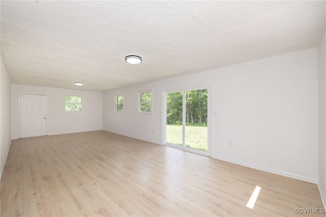 215 Glen Rd, Dillwyn, VA 23936 - unfurnished room featuring light wood finished floors, baseboards, and a textured ceiling