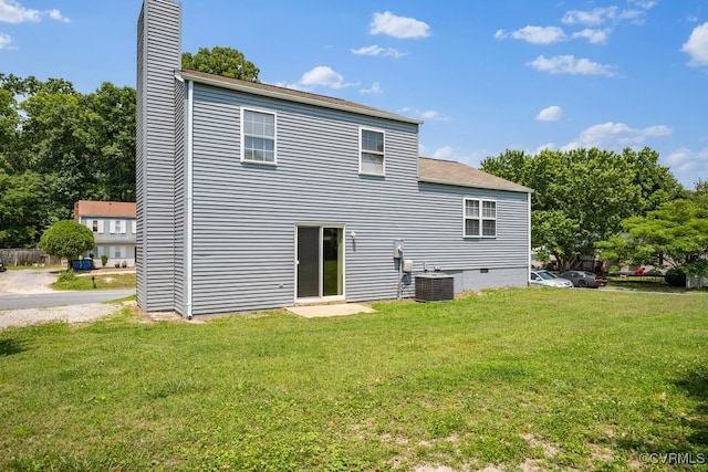9548 Bent Wood Ln, North Chesterfield, VA 23237 - rear view of house featuring a chimney, cooling unit, a yard, and a shingled roof