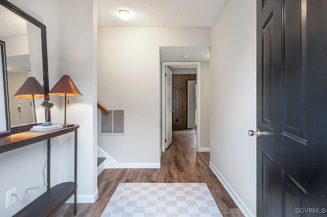 9548 Bent Wood Ln, North Chesterfield, VA 23237 - corridor with wood finished floors, a textured ceiling, and stairs