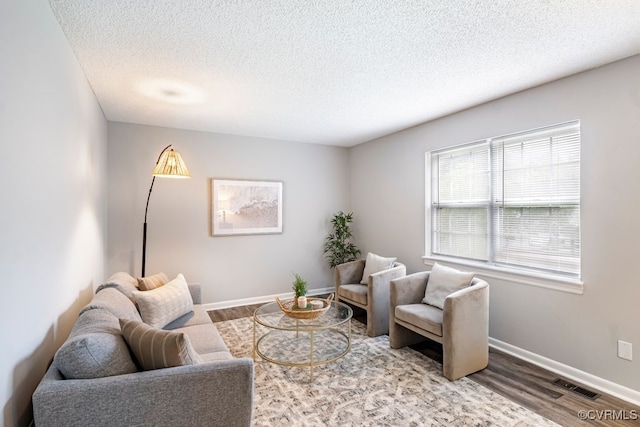 9548 Bent Wood Ln, North Chesterfield, VA 23237 - living area featuring a textured ceiling and wood finished floors