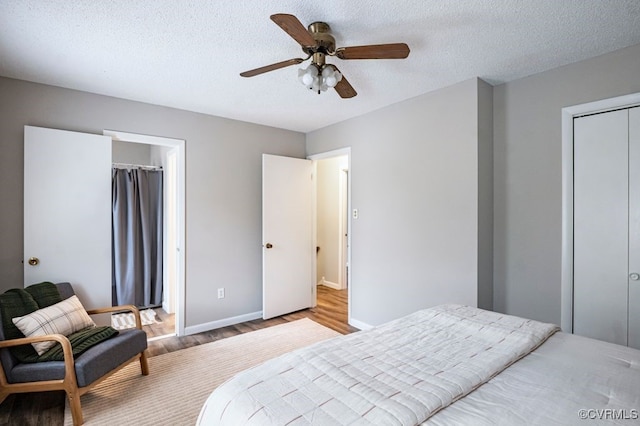 9548 Bent Wood Ln, North Chesterfield, VA 23237 - bedroom featuring wood finished floors, a textured ceiling, a closet, and ceiling fan