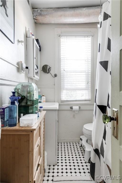 430 S Pine St, Richmond, VA 23220 - full bathroom with toilet, vanity, tile patterned flooring, and a shower with shower curtain
