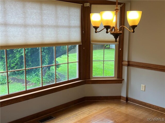 8172 Dunfee Ln, Mechanicsville, VA 23111 - unfurnished sunroom featuring a chandelier