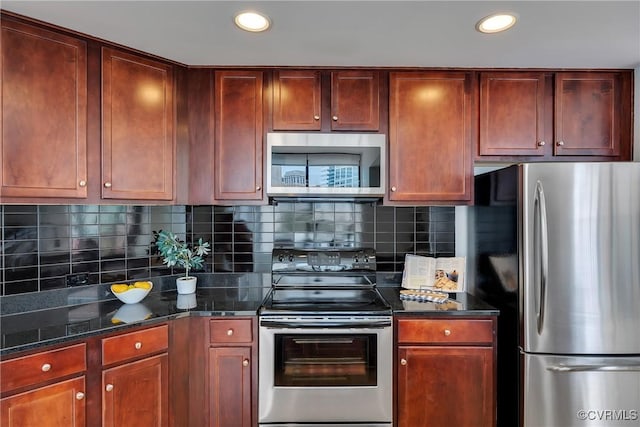 1101 Haxall Pt Unit U1001, Richmond, VA 23219 - kitchen featuring stainless steel appliances, recessed lighting, backsplash, reddish brown cabinets, and dark stone counters