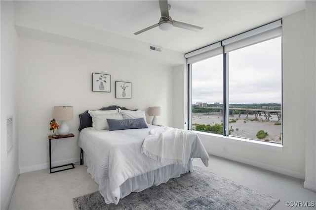 1101 Haxall Pt Unit U1001, Richmond, VA 23219 - bedroom with light colored carpet, baseboards, and a ceiling fan