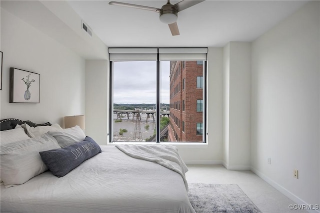 1101 Haxall Pt Unit U1001, Richmond, VA 23219 - bedroom featuring carpet floors, floor to ceiling windows, baseboards, access to outside, and a ceiling fan