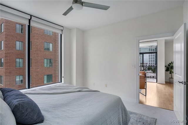 1101 Haxall Pt Unit U1001, Richmond, VA 23219 - bedroom featuring baseboards, a ceiling fan, and carpet floors
