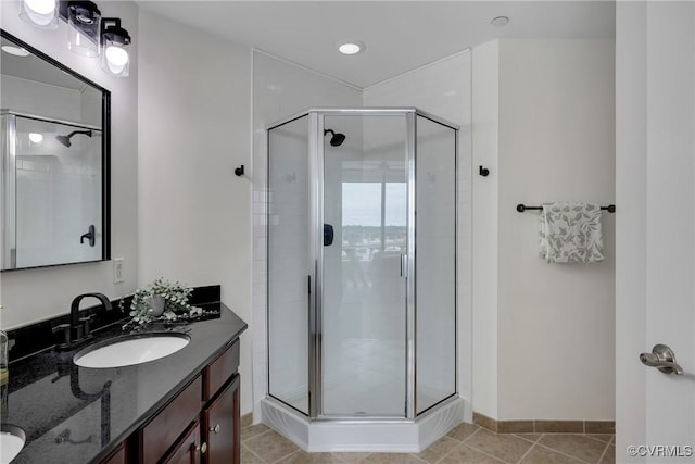 1101 Haxall Pt Unit U1001, Richmond, VA 23219 - full bath featuring double vanity, a stall shower, and tile patterned floors