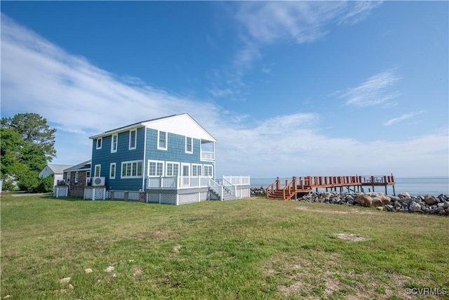 154 Riverside Dr, Deltaville, VA 23043 - view of home's exterior featuring a yard, stairs, and a deck with water view