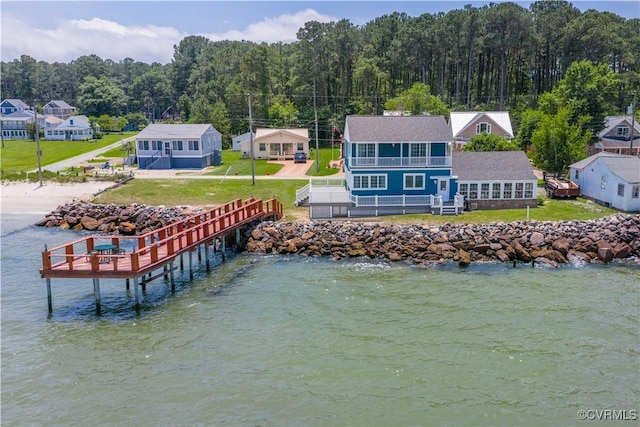 154 Riverside Dr, Deltaville, VA 23043 - dock featuring a yard, a view of trees, a water view, and a balcony