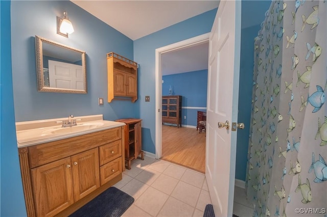 154 Riverside Dr, Deltaville, VA 23043 - bathroom featuring vanity, tile patterned floors, a shower with curtain, and baseboards