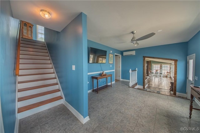154 Riverside Dr, Deltaville, VA 23043 - stairs with a wall mounted air conditioner, ceiling fan, plenty of natural light, and tile patterned floors