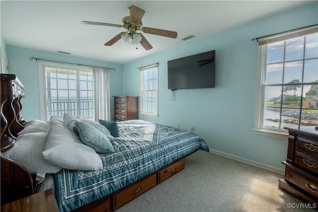 154 Riverside Dr, Deltaville, VA 23043 - carpeted bedroom with baseboards and a ceiling fan
