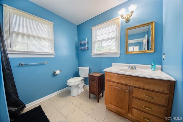 154 Riverside Dr, Deltaville, VA 23043 - full bath with vanity, toilet, tile patterned floors, and baseboards