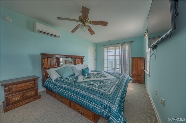 154 Riverside Dr, Deltaville, VA 23043 - carpeted bedroom featuring a wall unit AC, baseboards, and a ceiling fan