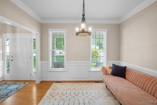 14825 Windjammer Dr, Midlothian, VA 23112 - entryway with light wood-type flooring, a wainscoted wall, and crown molding