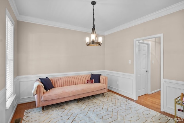 14825 Windjammer Dr, Midlothian, VA 23112 - sitting room with ornamental molding, wood finished floors, a wainscoted wall, and a chandelier
