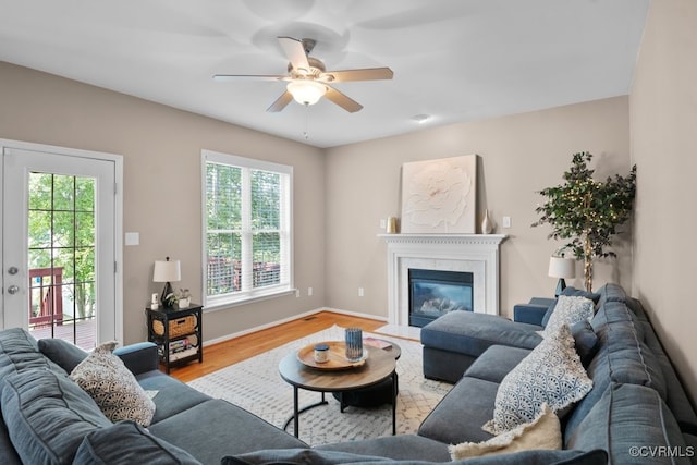 14825 Windjammer Dr, Midlothian, VA 23112 - living room featuring healthy amount of natural light, ceiling fan, wood finished floors, and a glass covered fireplace